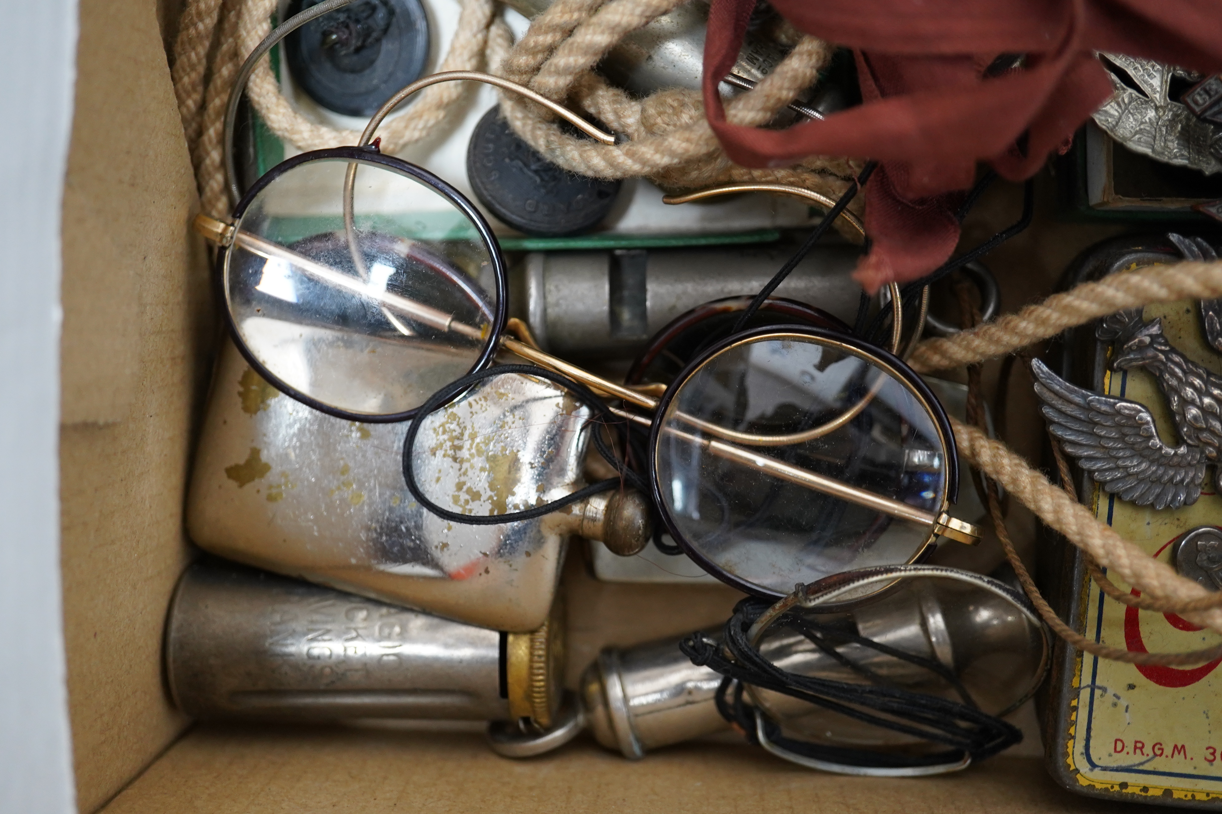 A collection of military medals, cap badges and buttons etc. including; a First World War Royal Navy Air Service cap badge, two WWI medal trios awarded to PTE. V.J.P. Barnes RIF. BRIG., and L.Cpl. W. Howard. NOTTS & DERB